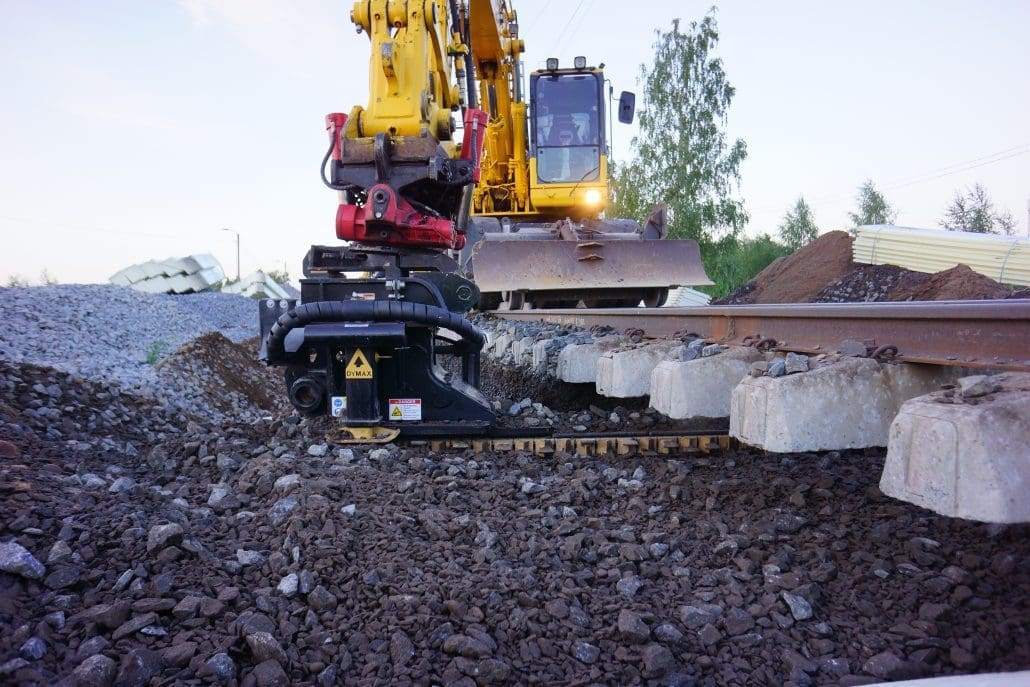 Click to show details - DymaxRail Ballast Blaster Undercutter Railway Attachment DymaxRail Ballast Blaster Undercutter attachment in operation on railroad track