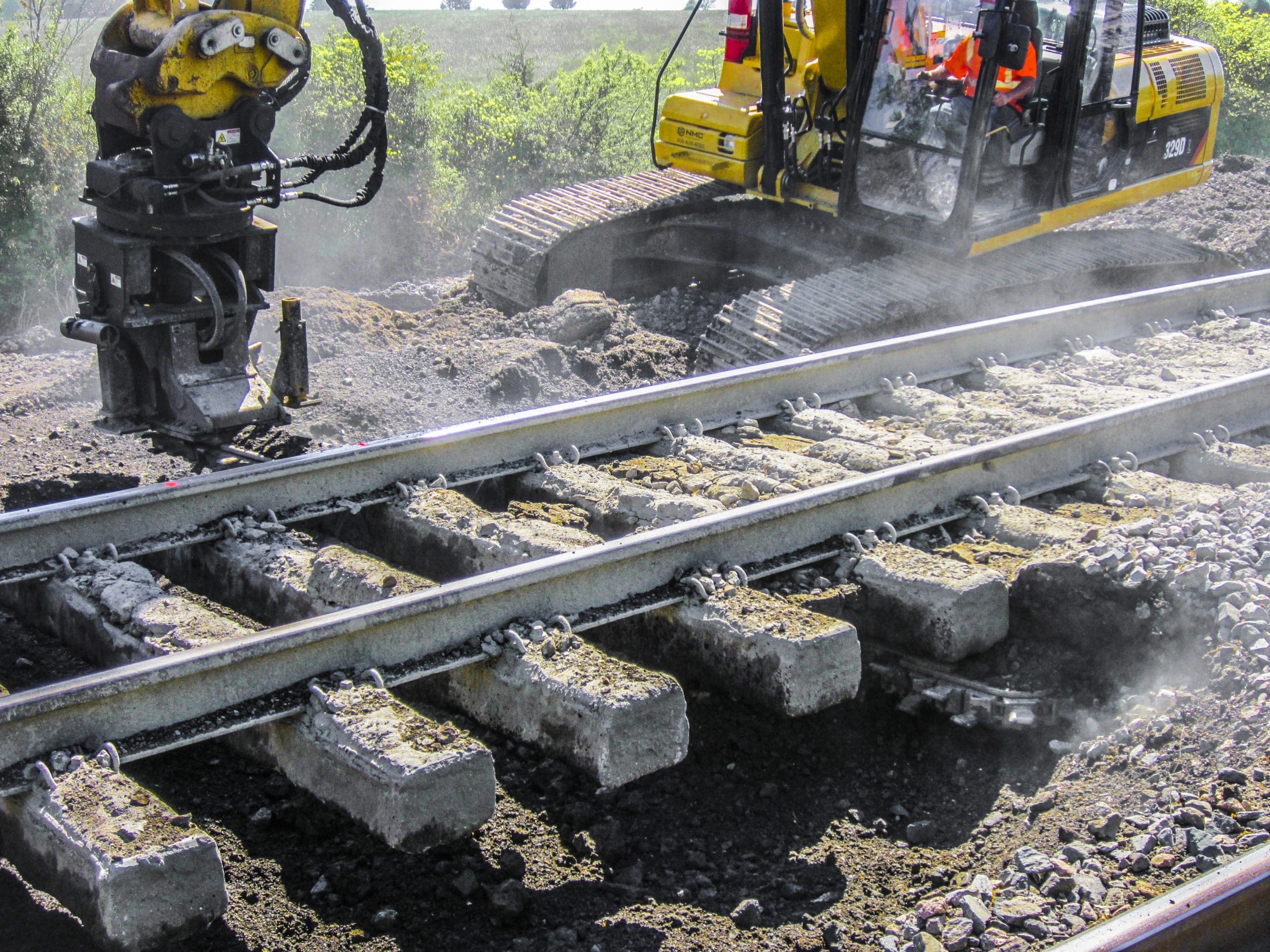 DymaxRail Ballast Blaster Undercutter on Railway Excavator