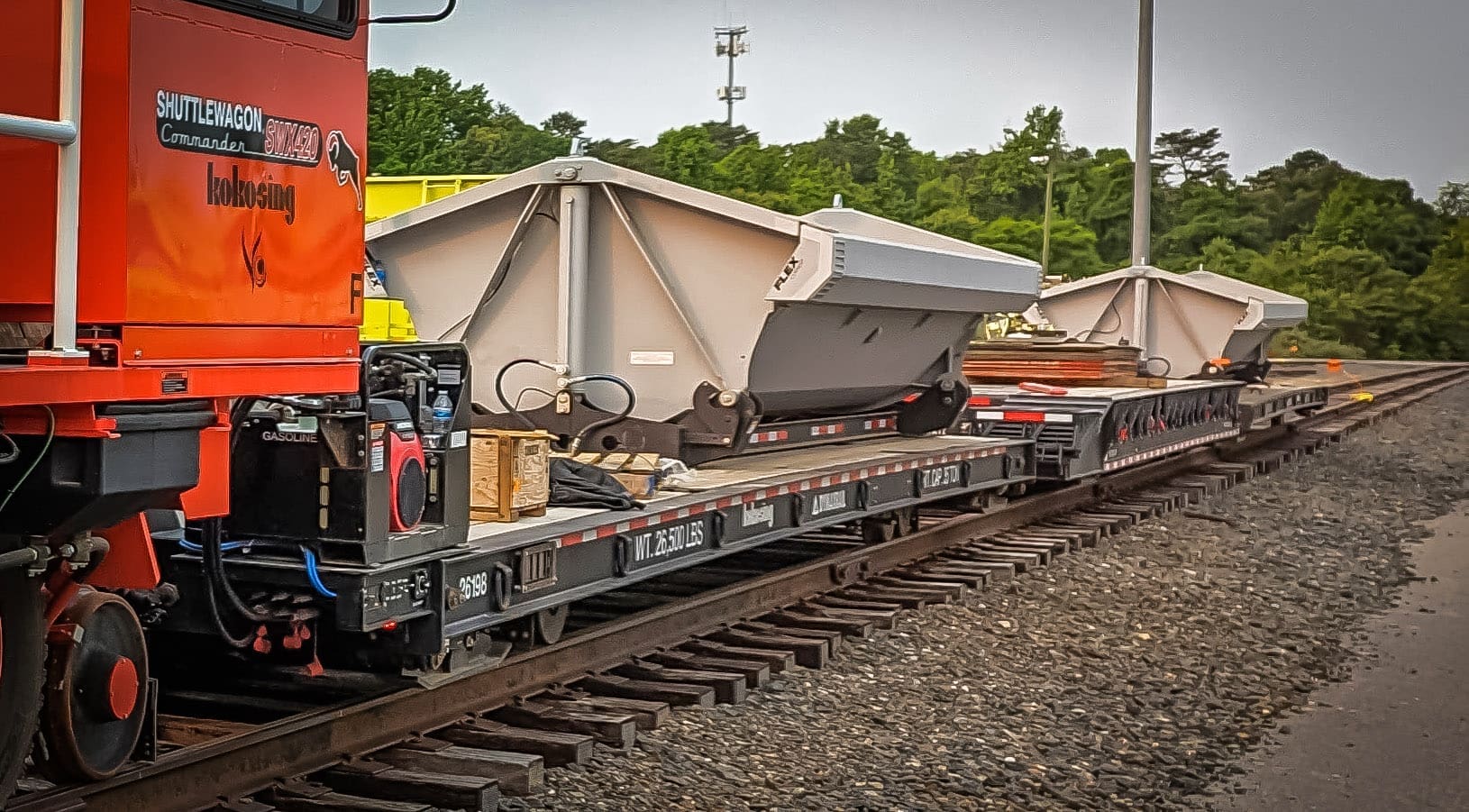 7630D1-Dump Trailer-in use Edited Side Dump Machinery Cart