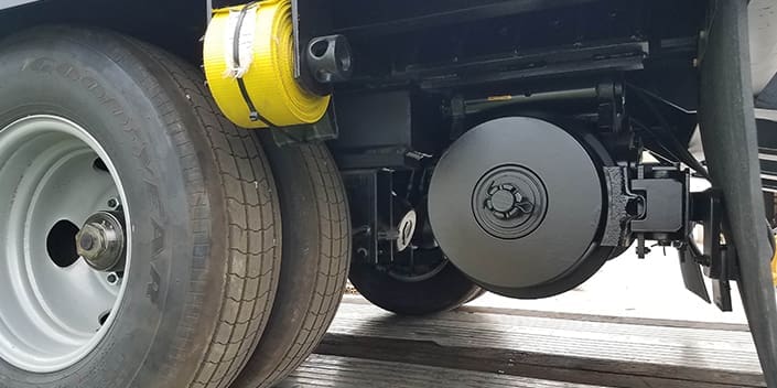 Rail gear and brakes on hi rail trailer built by DymaxRail Close up photo of rail gear and brakes on hi rail tag-along trailer built by DymaxRail