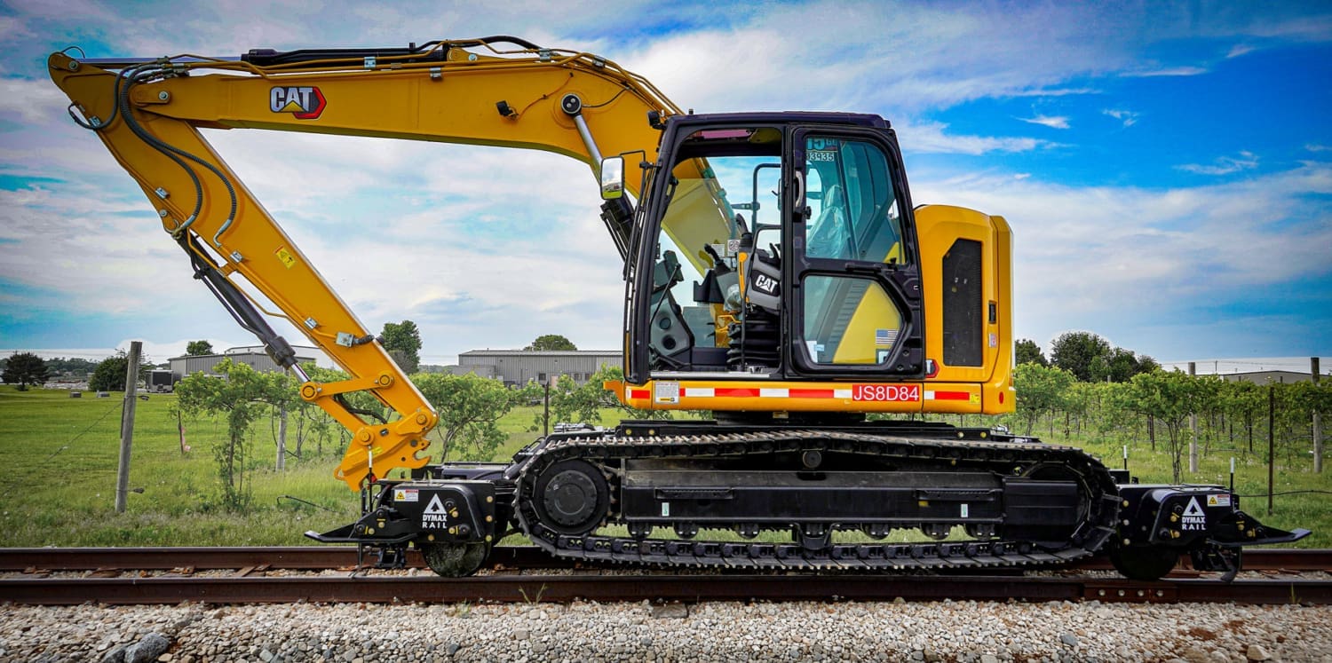 DymaxRail Rail Rider X2-15T Hi-Rail System DymaxRail X2-15T hi-rail attachment on track excavator