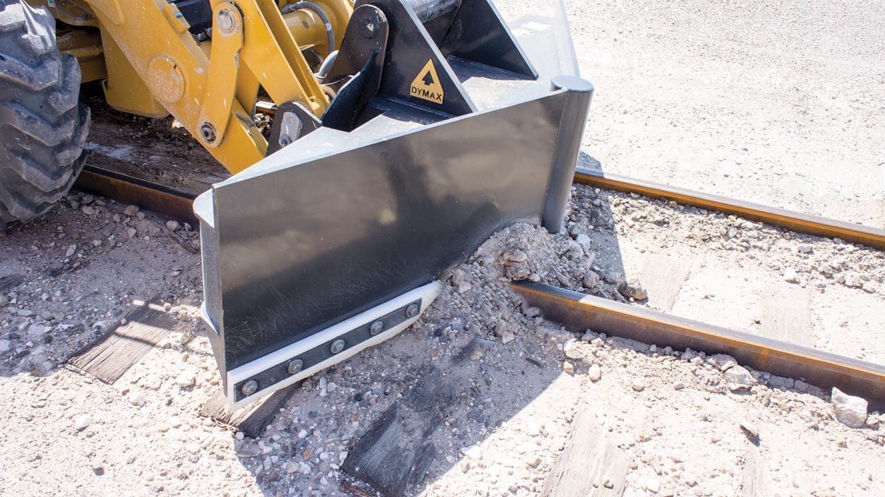 DymaxRail Rail Ballast Plow V-blade attachment, on-track application showing blade angle