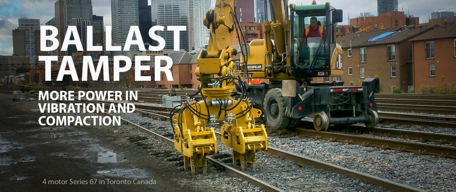 DymaxRail Series 67 ballast tamper attachment on excavator for production mainline tamping