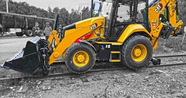 dymax-rail-rider-bl-backhoe-loader-hi-rail-system Backhoe loader with Dymax Rail Rider BL hi-rail conversion system