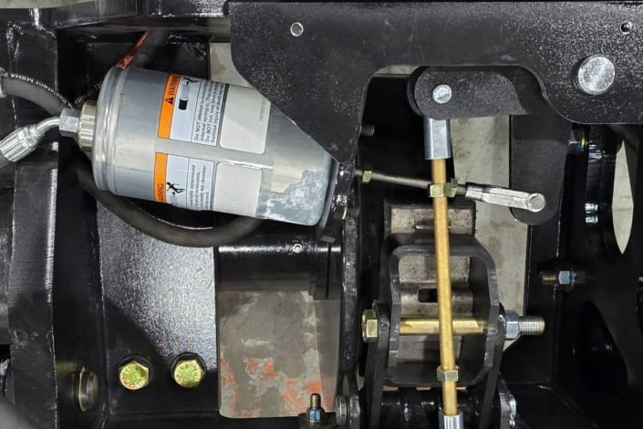 Dymax Rail Rider X2-15T fail-safe spring-applied hydraulic release (SAHR) braking Close-up of the Dymax Rail Rider X2-15T spring-applied hydraulic release (SAHR) braking system, providing dependable stopping power with a manual hydraulic hand pump backup